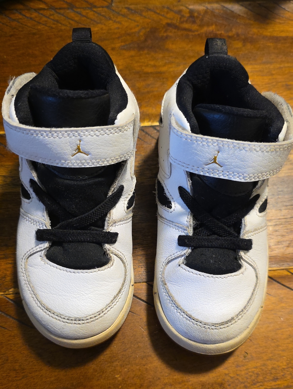 Jordan Kids' White and Black High-Top Sneakers with Gold Jumpman